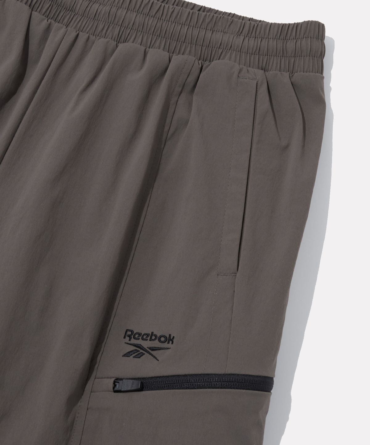 리복(REEBOK) 올커버 스트레치 2WAY 팬츠 - 스톤 카키