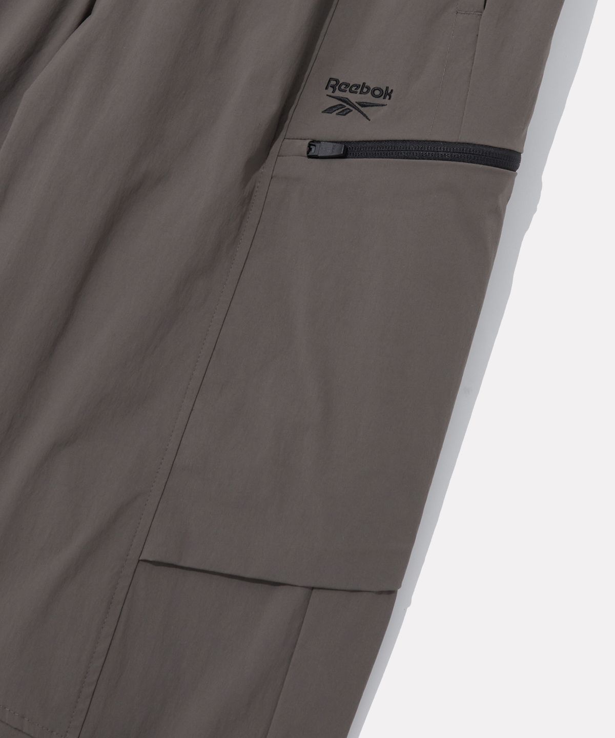리복(REEBOK) 올커버 스트레치 2WAY 팬츠 - 스톤 카키