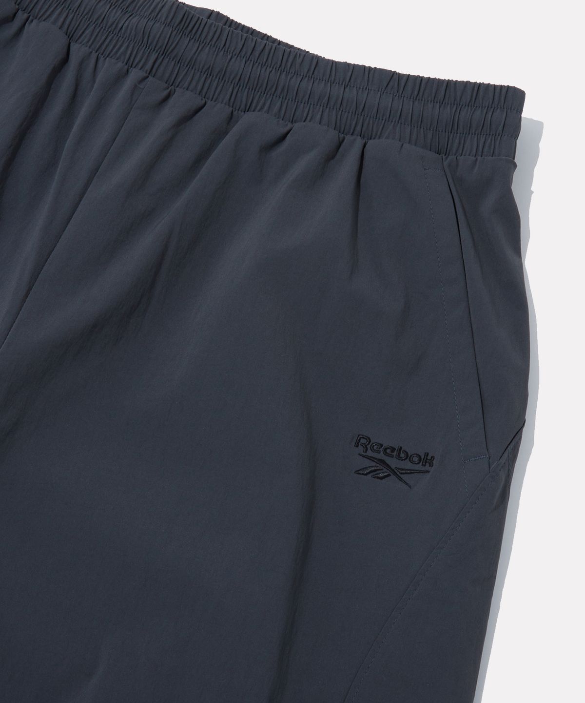 리복(REEBOK) 올커버 스트레치 2WAY 팬츠 (W) - 차콜
