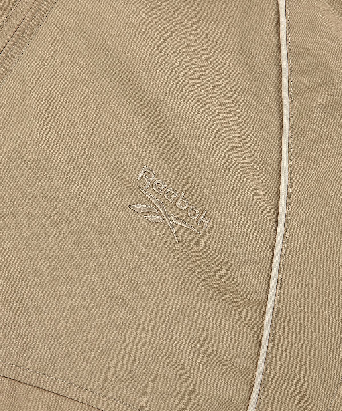 리복(REEBOK) 그리드 후드 윈드 브레이커 (W) - 베이지