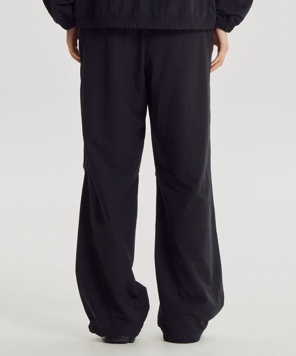 뉴발란스(NEW BALANCE) NBNTG3W812 / WOMEN 에센셜 웜업 우븐 와이드팬츠 (BLACK)