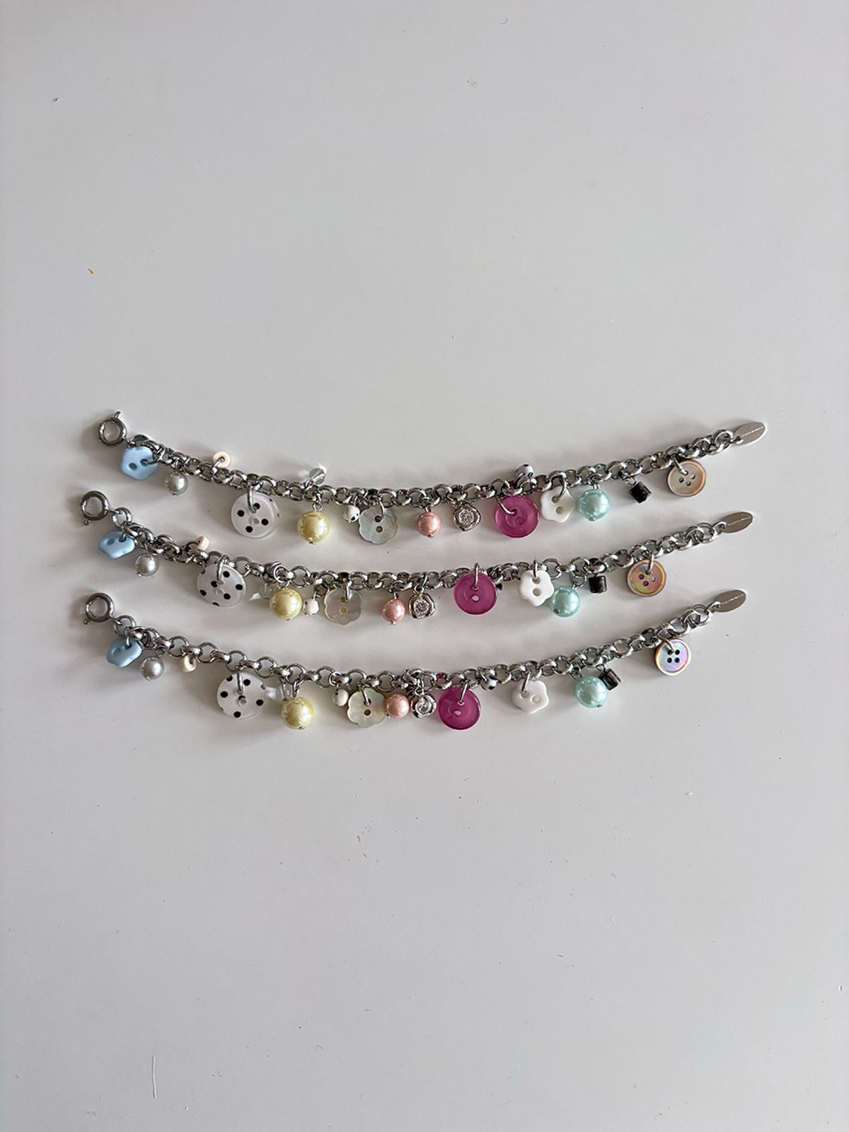 코지웨이브클럽(COZYWAVECLUB) CANDY BUTTON BRACELET