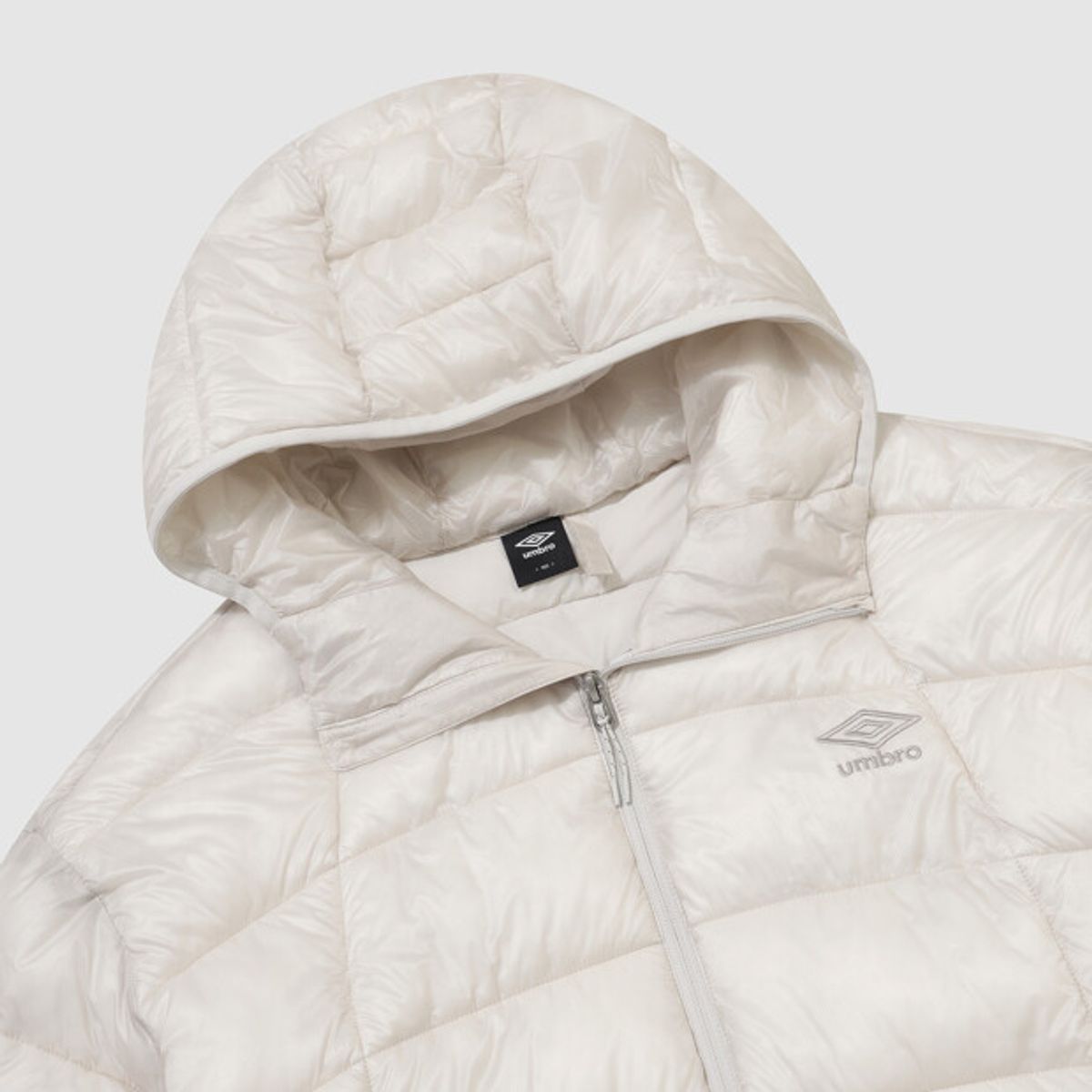 엄브로(UMBRO) 엑스레이 후드 경량 패딩 자켓 아이보리 UR421CPJO1