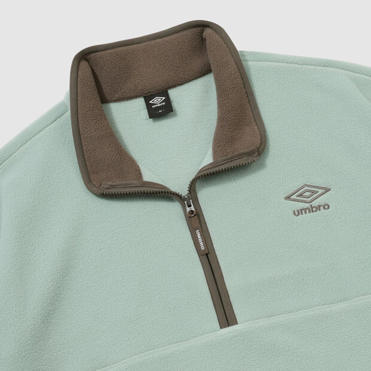 엄브로(UMBRO) 알파플리스 스탠넥 하프집업 민트 UR423CFSN1