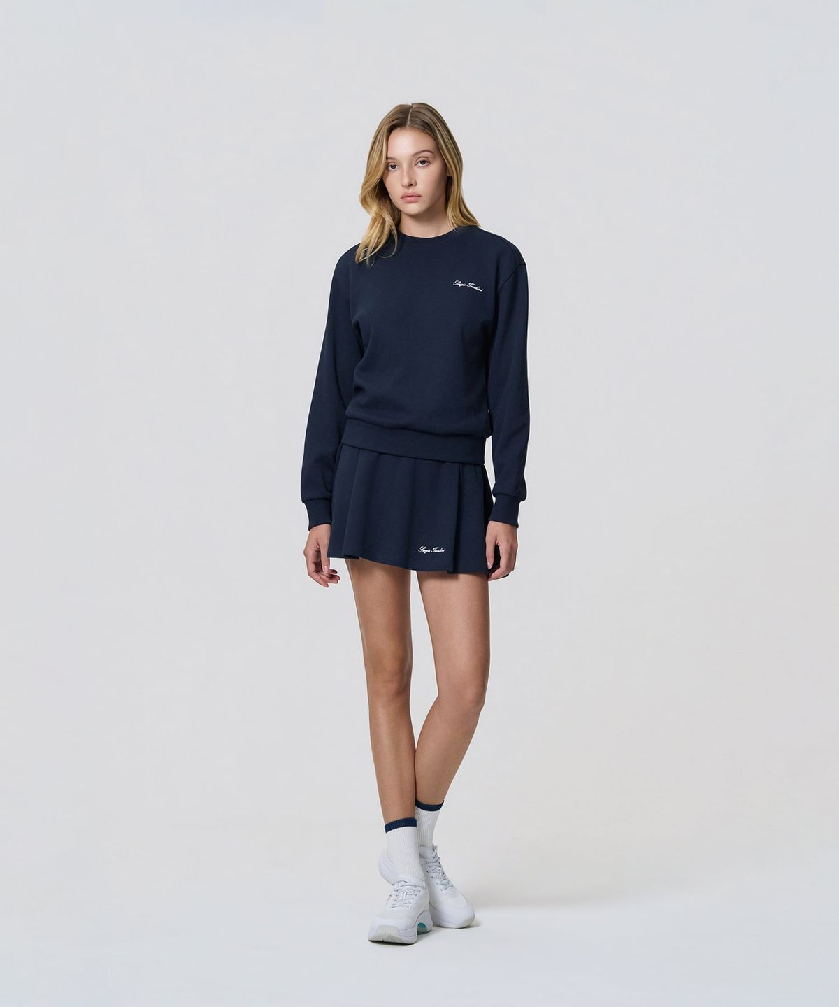 세르지오 타키니(SERGIO TACCHINI) W 타키니 60th 플레어 스커트 (Navy)