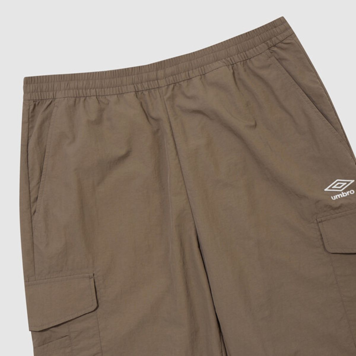 엄브로(UMBRO) 클래식 우븐 조거 팬츠 브라운 UR323CPT94