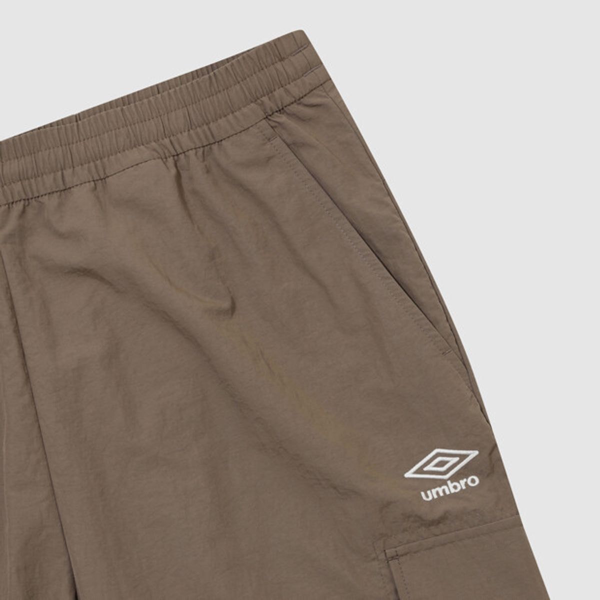 엄브로(UMBRO) 클래식 우븐 조거 팬츠 브라운 UR323CPT94