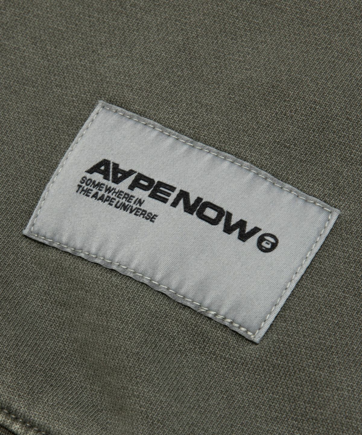 에이프(AAPE) AAPENOW 라운드 로고 워싱 플리스 맨투맨 / AAPSWMC350XXPKHE