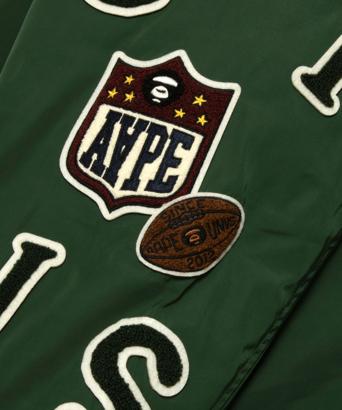 에이프(AAPE) 문페이스 콜라쥬 뱃지 베이스볼 재킷 / AAPJKM7742XXPGRD