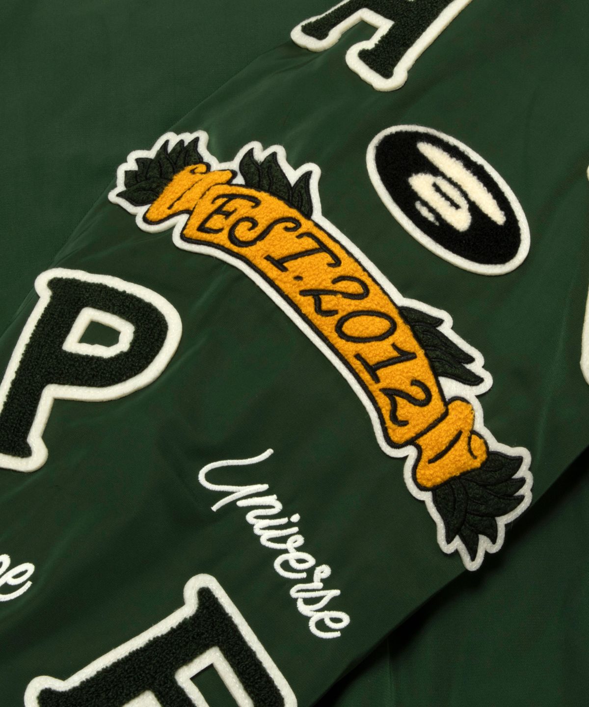 에이프(AAPE) 문페이스 콜라쥬 뱃지 베이스볼 재킷 / AAPJKM7742XXPGRD
