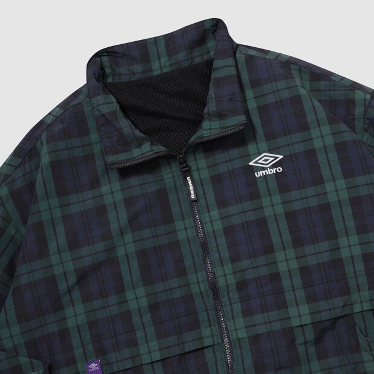 엄브로(UMBRO) 클래식 스탠넥 웜업 바람막이 자켓 그린 패턴 UR321CJK93