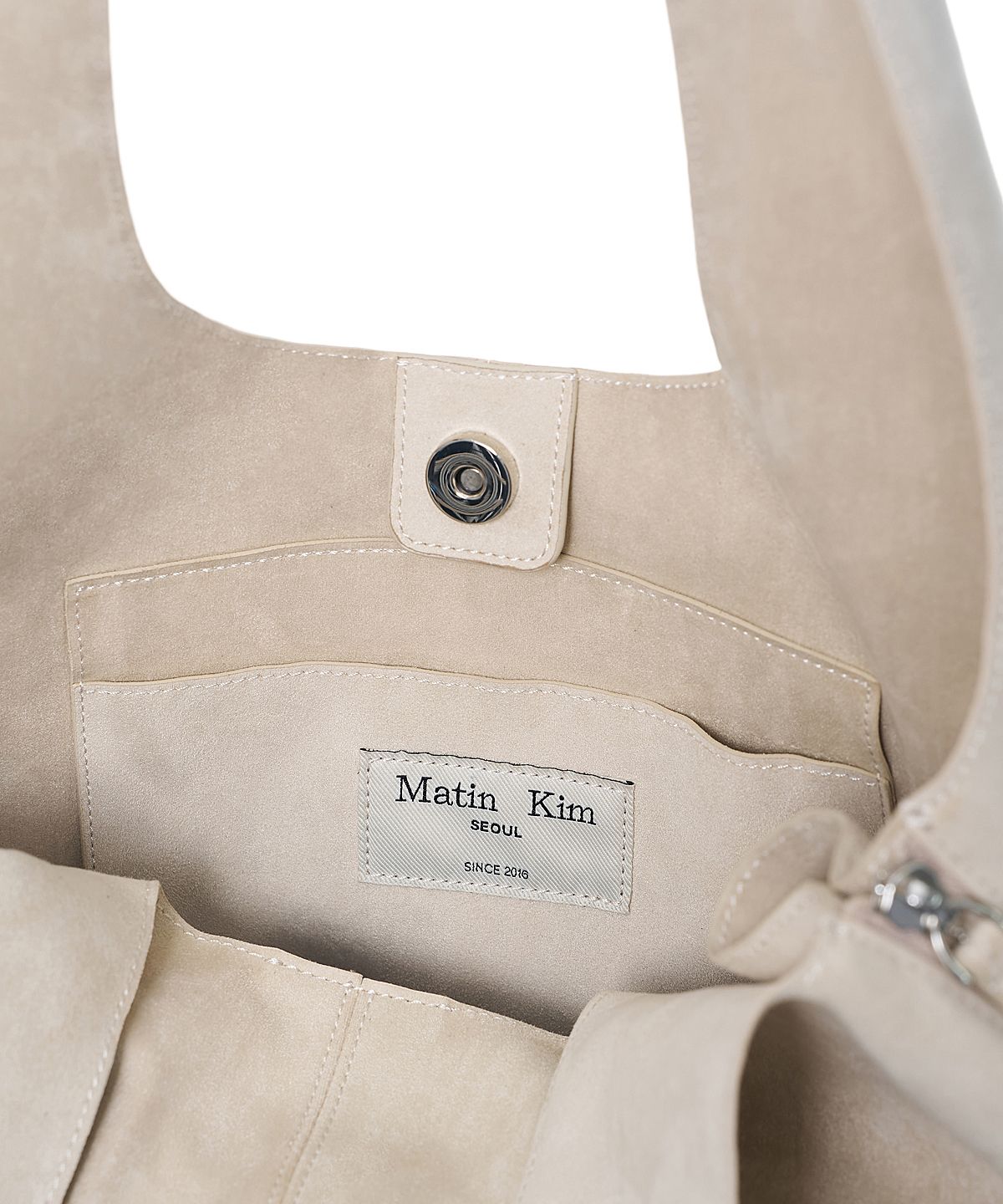 마뗑킴(MATIN KIM) SIDE ZIP SUEDE SHOULDER BAG IN IVORY