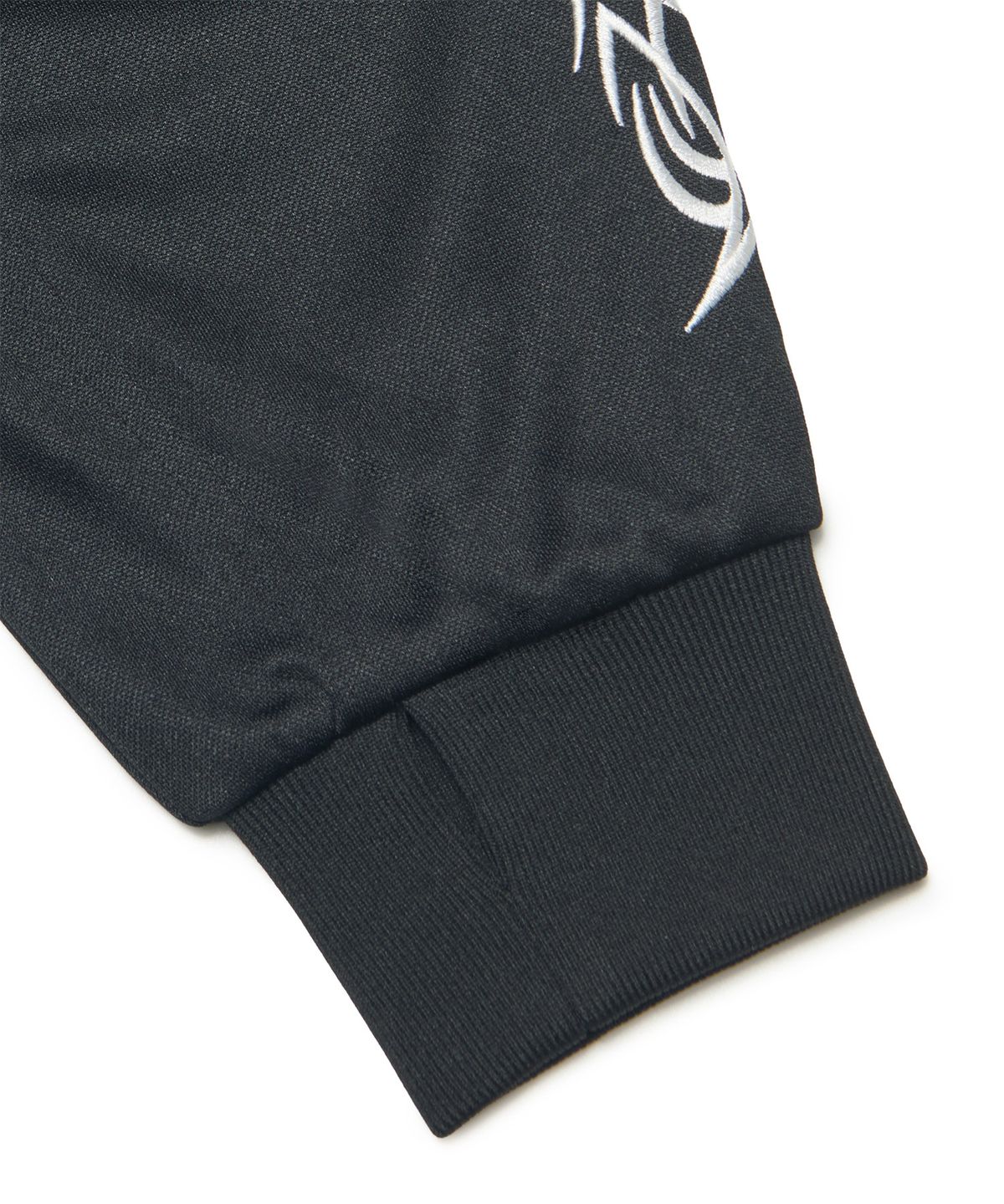 노매뉴얼(NOMANUAL) EMBROIDERED TRIBAL TRACK TOP - BLACK