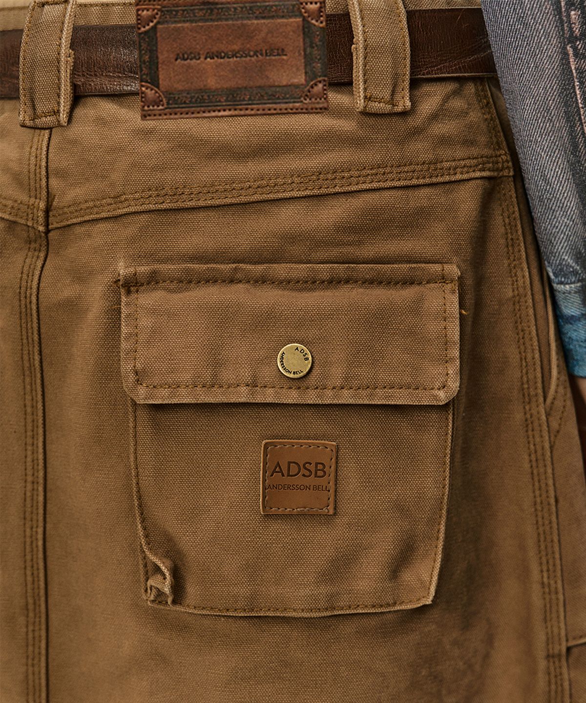 앤더슨벨(ADSB ANDERSSON BELL) CARGO POCKET WRAP SKIRT (BROWN)