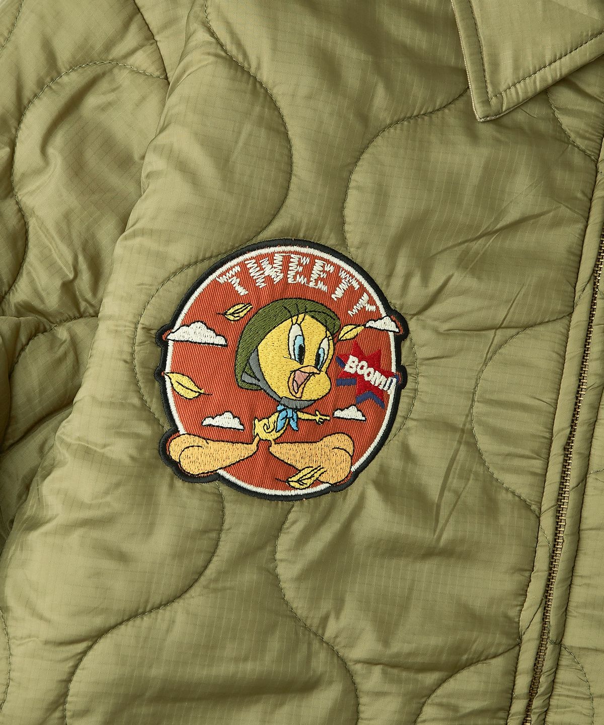 아웃스탠딩(OUTSTANDING) [LOONEY TUNES] REVERSIBLE QUILTED JACKET_KHAKI/OLIVE GREEN
