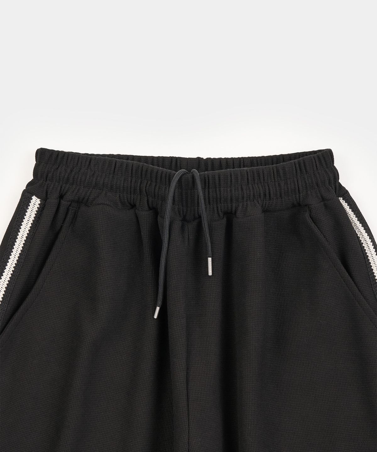 엑스컨테이너(EXCONTAINER) 와플 사이드 라인 트랙 팬츠 (BLACK)