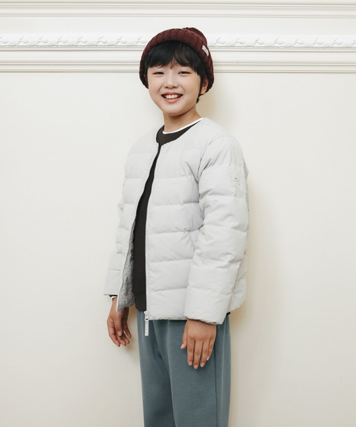스노우피크 어패럴(SNOWPEAK APPAREL) 키즈 경량 타슬란 라운드넥 경량 다운 자켓 (S26WKLDJ82) Stone Gray