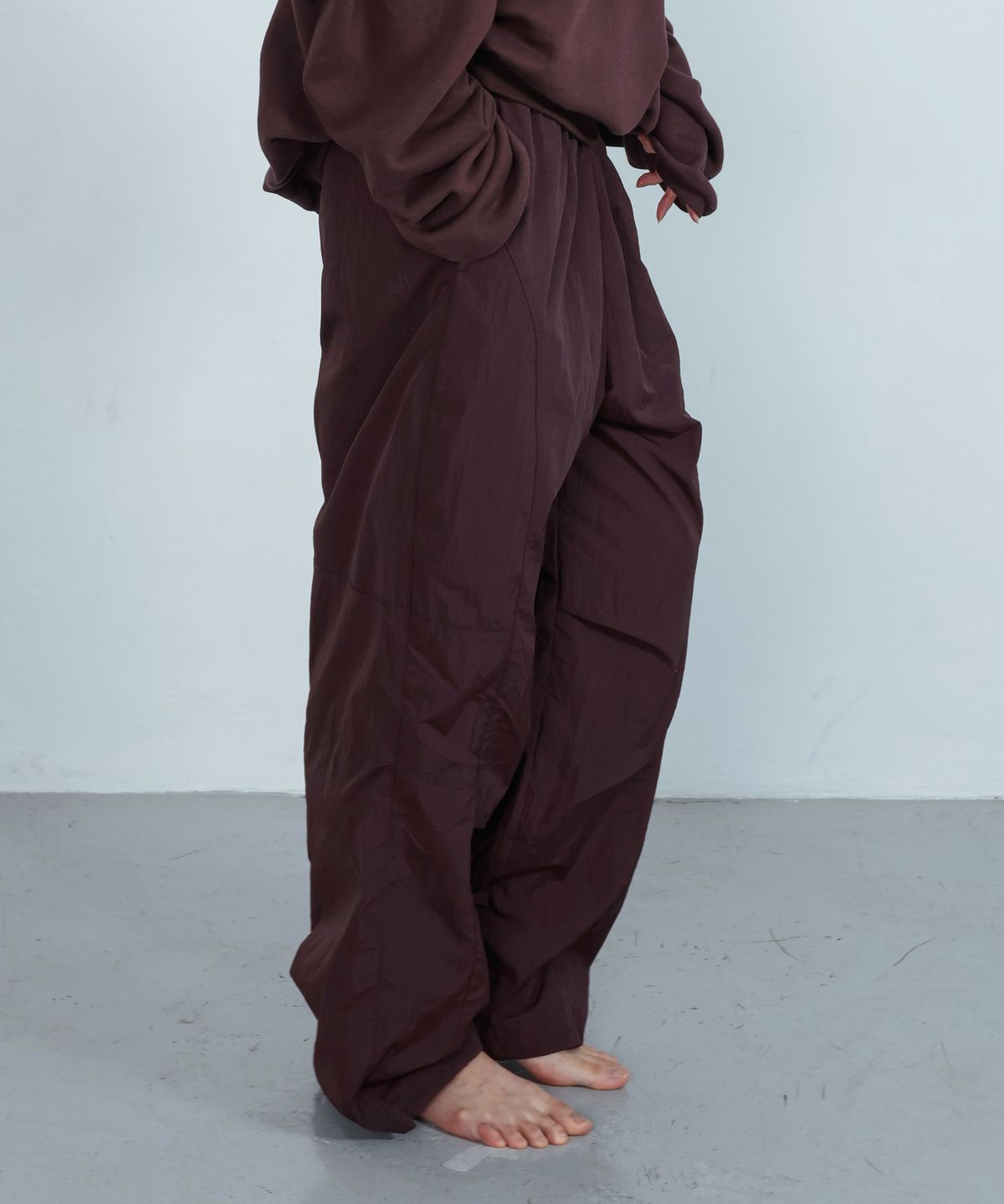 키지코(KIJIKO) ke619. Eyelet Folding Nylon Pants Burgundy