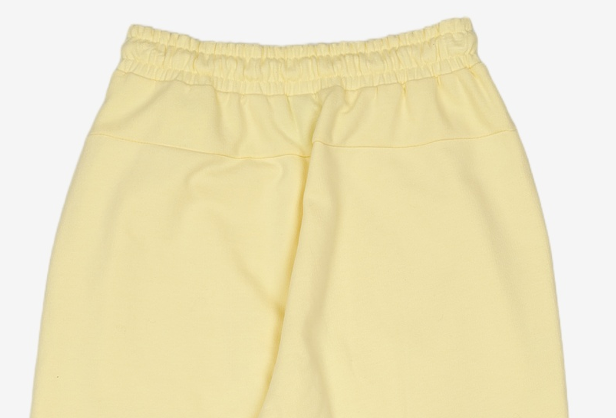 엄브로(UMBRO) 아카이브 클럽 우먼스 와이드 원턱 팬츠 페일 바나나 (UO122CFP12) XS