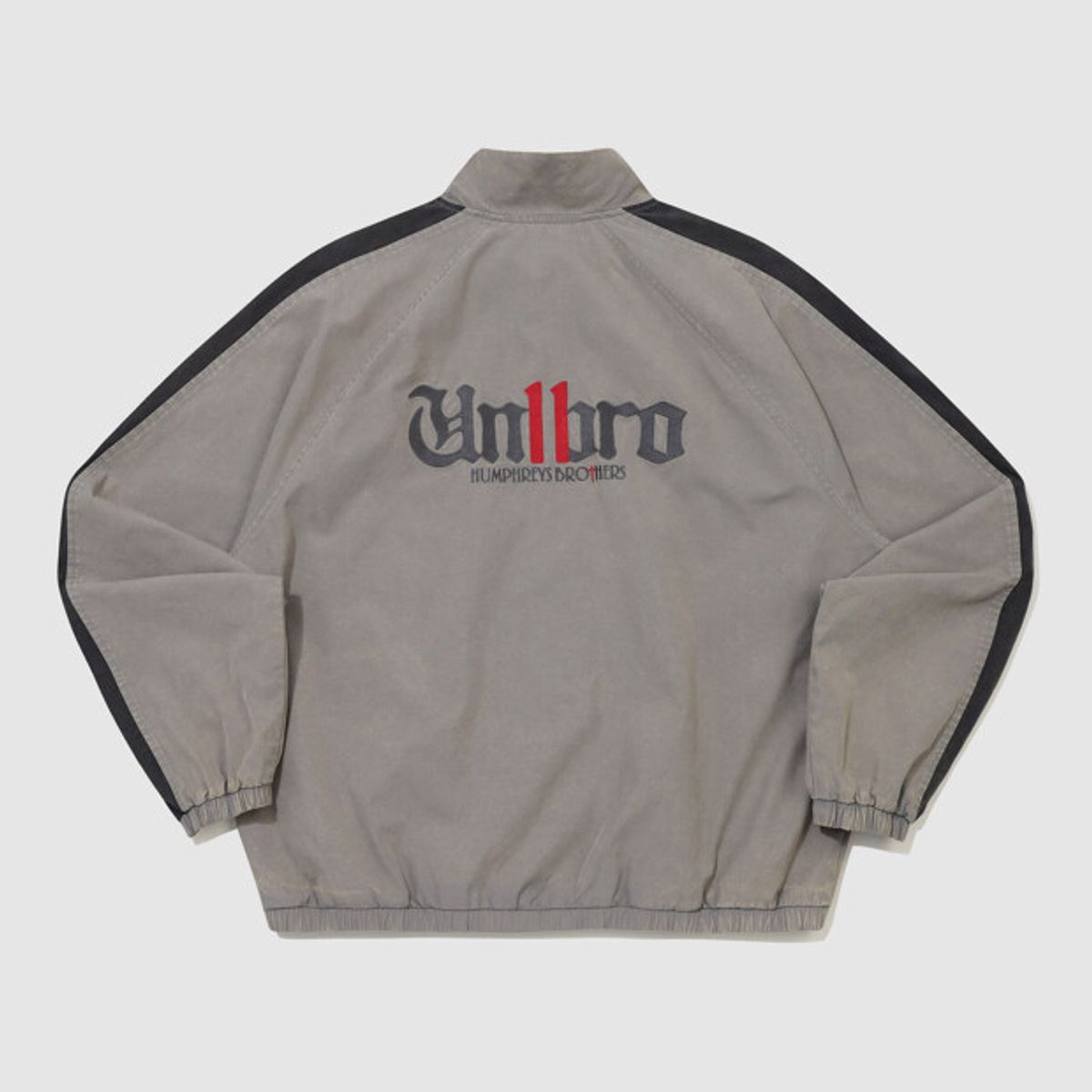 엄브로(UMBRO) DISTRICT11 스탠넥 워싱 바람막이 자켓 그레이 UR321CJK99