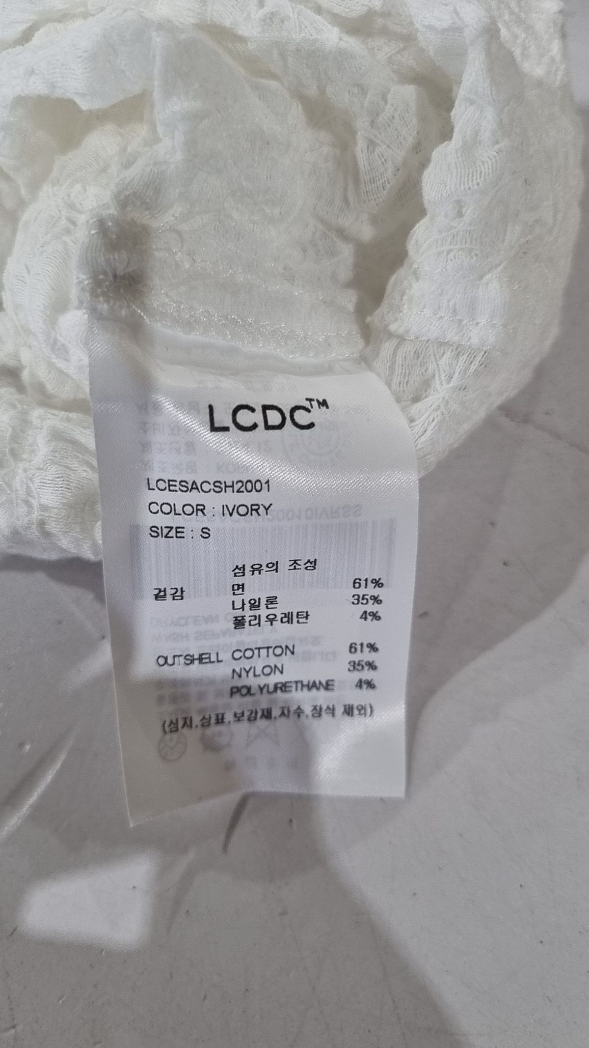 엘씨디씨티엠(LCDC™) RUFFLED SLEEVELESS SHIRT (IVORY) S
