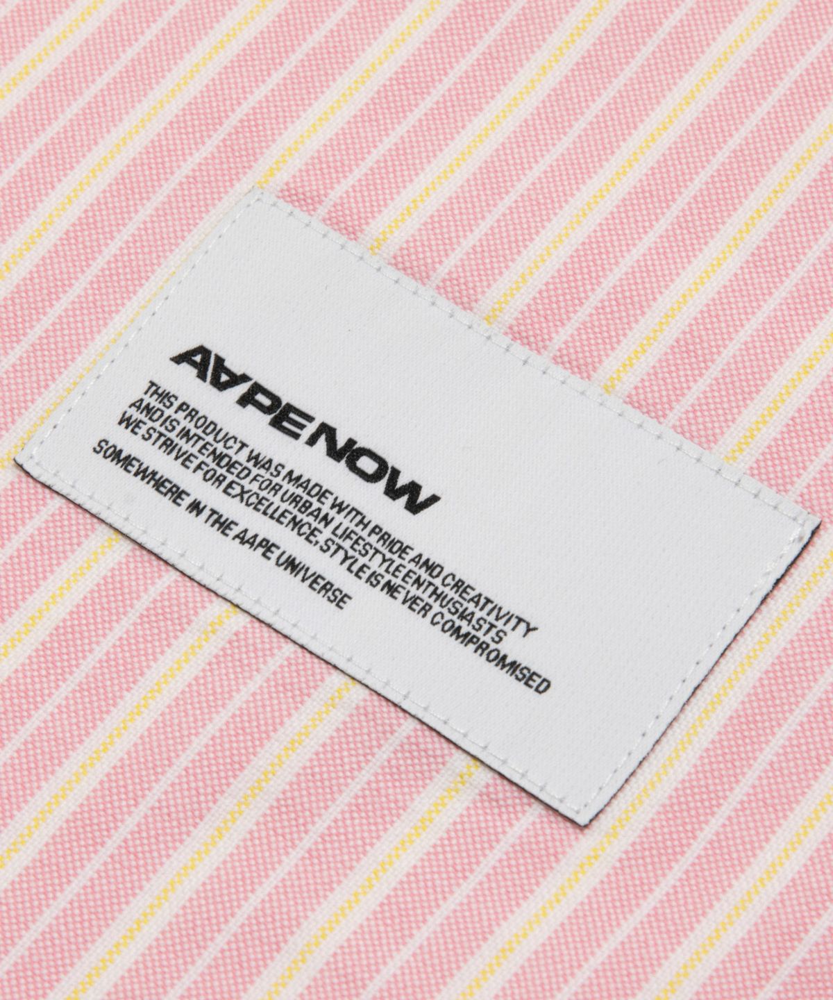 에이프(AAPE) AAPENOW Moonface 스트라이프 긴팔 셔츠 핑크 / AAPSTM8584XXRPKA