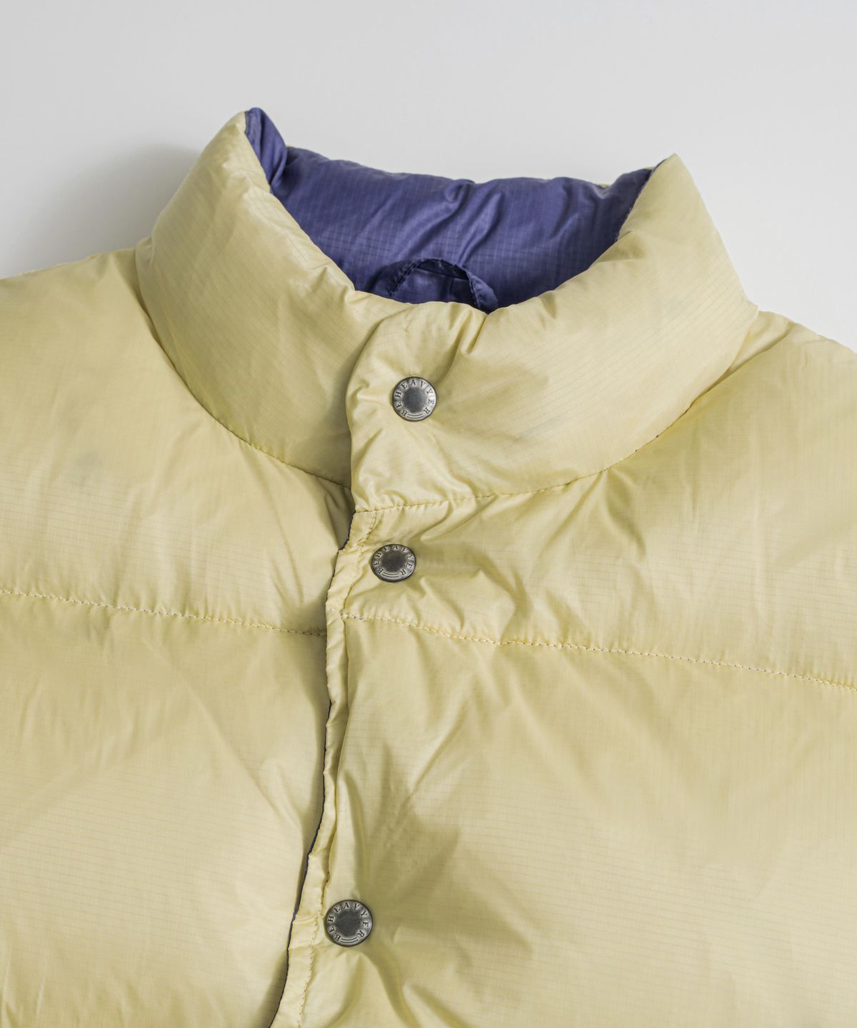 비헤비어(BEHEAVYER) REVERSIBLE DUCK DOWN VEST lemon/l.purple