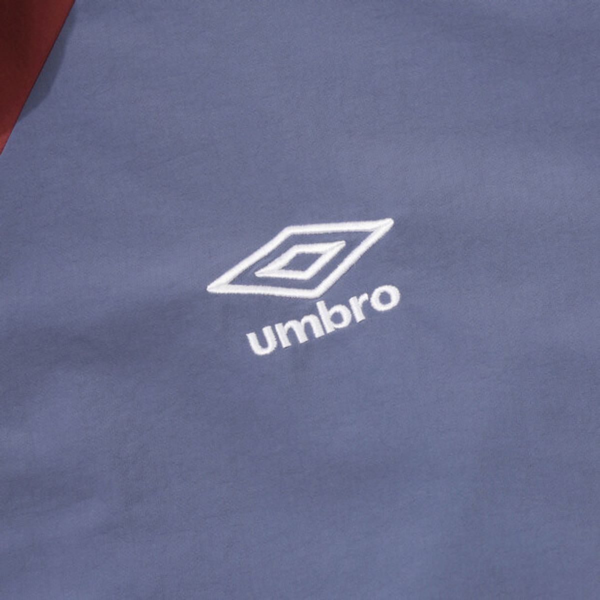 엄브로(UMBRO) 더비클럽 컬러블럭 스탠넥 바람막이 자켓 블루 UR324CJK94