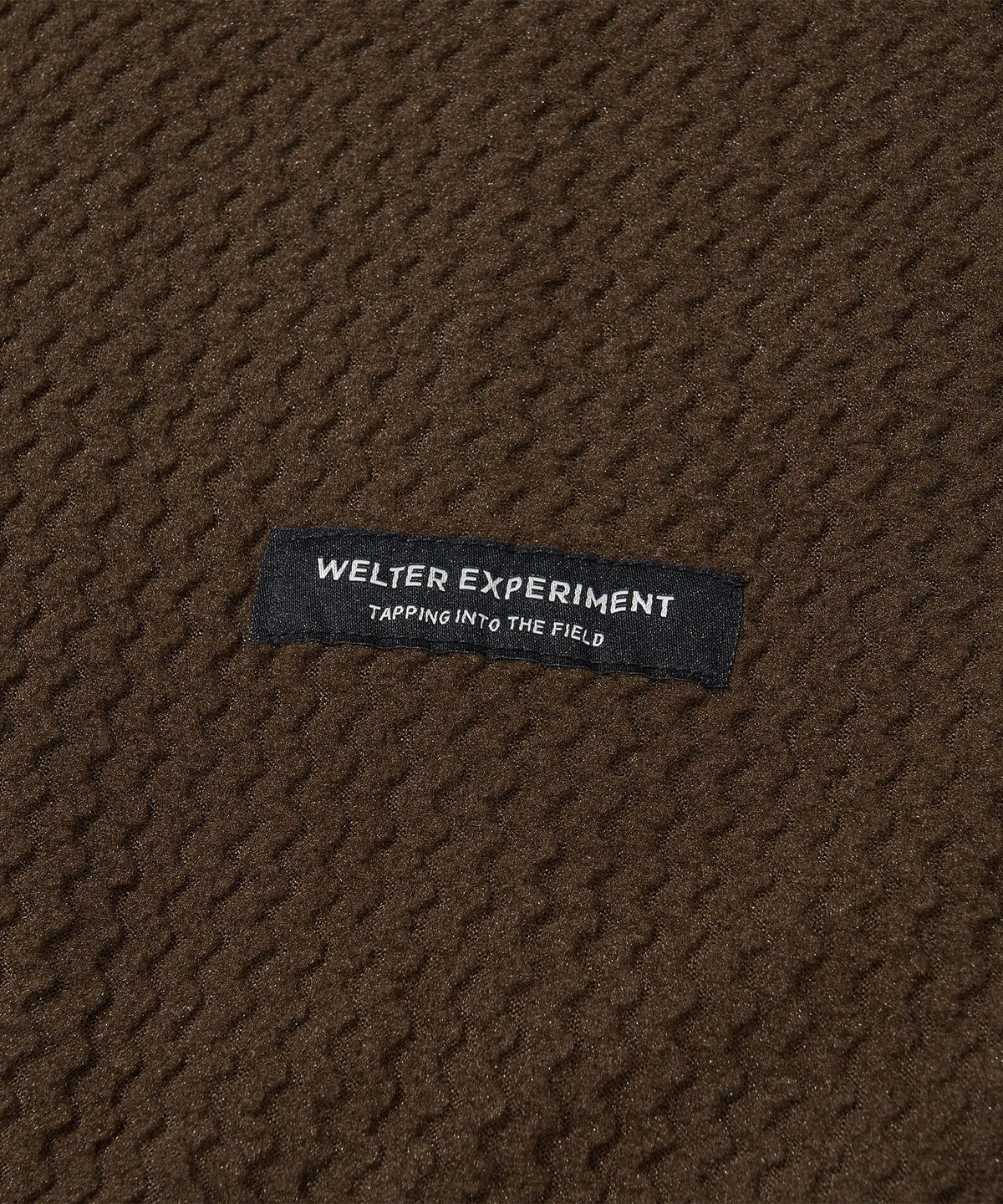웰터 익스페리먼트(WELTER EXPERIMENT) 칼로라 플리스 후디드 풀오버 다크 브라운