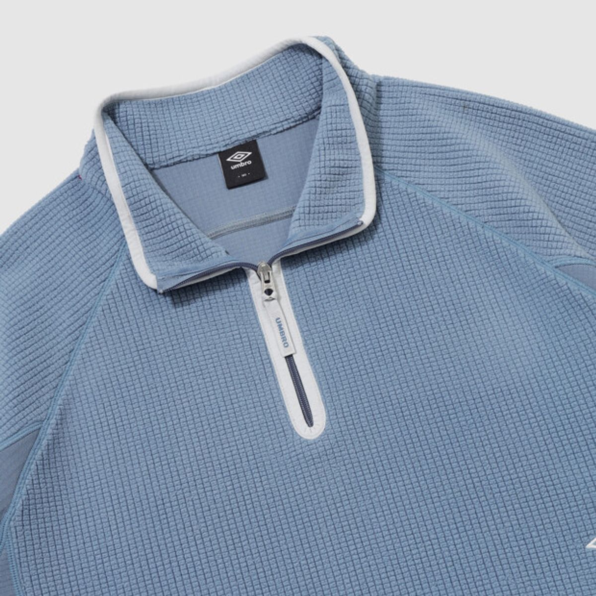 엄브로(UMBRO) 그리드 플리스 쿼터 집업 블루 UR421CFSO2