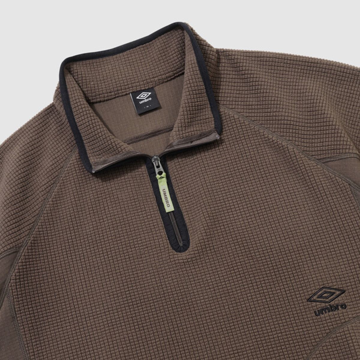 엄브로(UMBRO) 그리드 플리스 쿼터 집업 브라운 UR421CFSO2