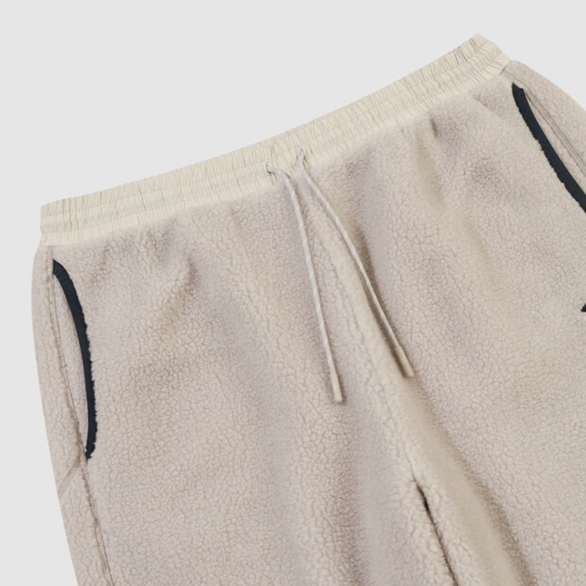 엄브로(UMBRO) 쉐르파 플리스 조거 팬츠 베이지 UR423CFPO5