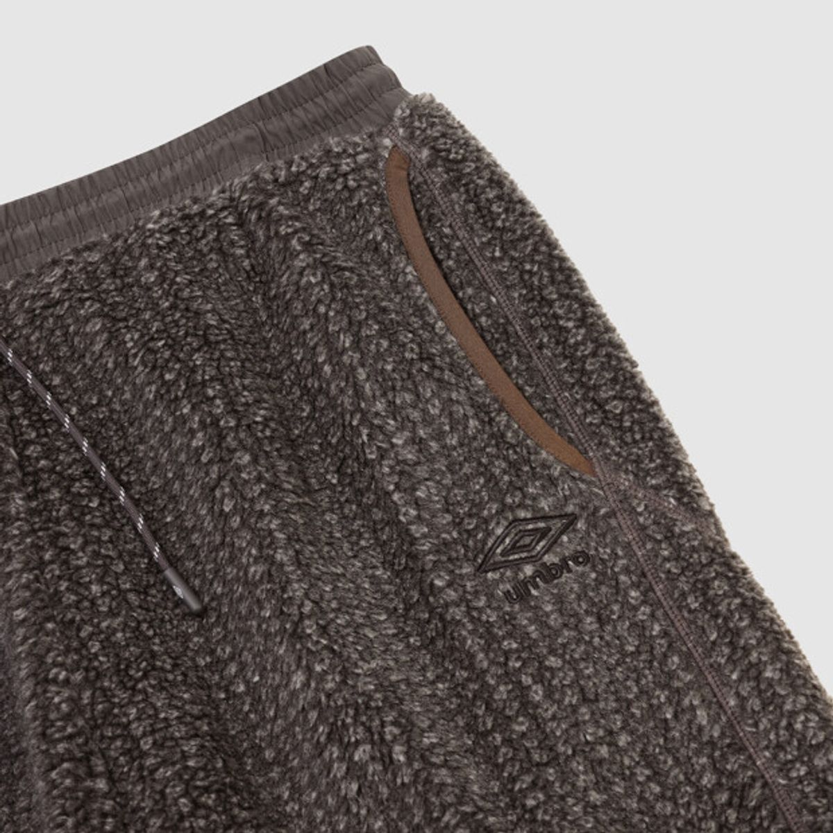 엄브로(UMBRO) 쉐르파 플리스 조거 팬츠 브라운 UR423CFPO5