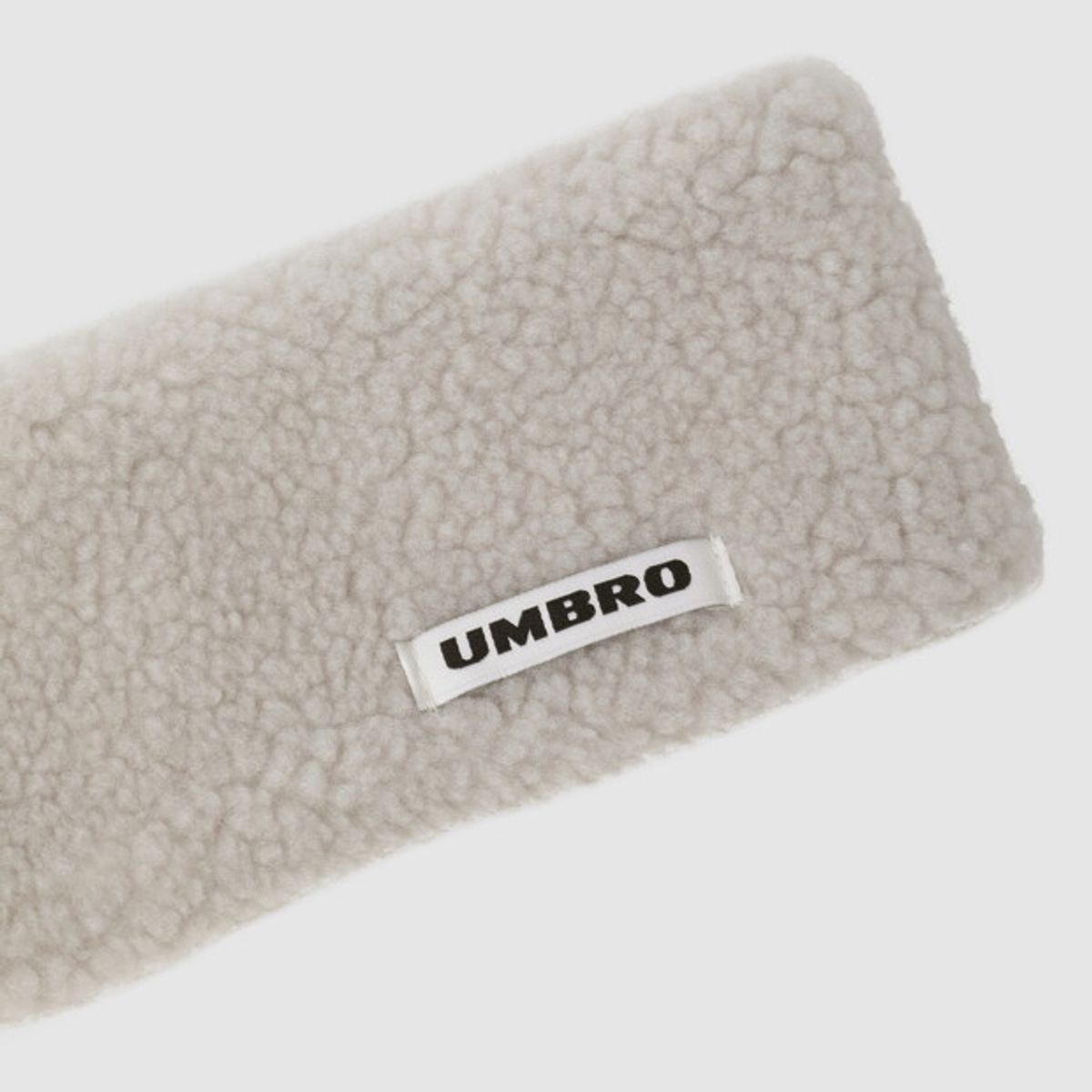 엄브로(UMBRO) 시어링 헤어밴드 아이보리 UR423CAOO2