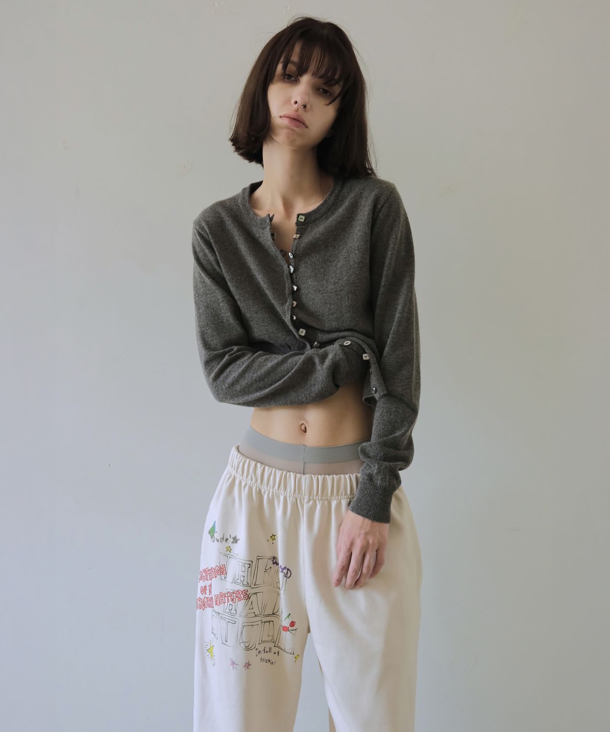 더블유케이엔디 프로젝트(WKND PROJECT) ASYMMETRIC KNIT CARDIGAN (CHARCOAL)