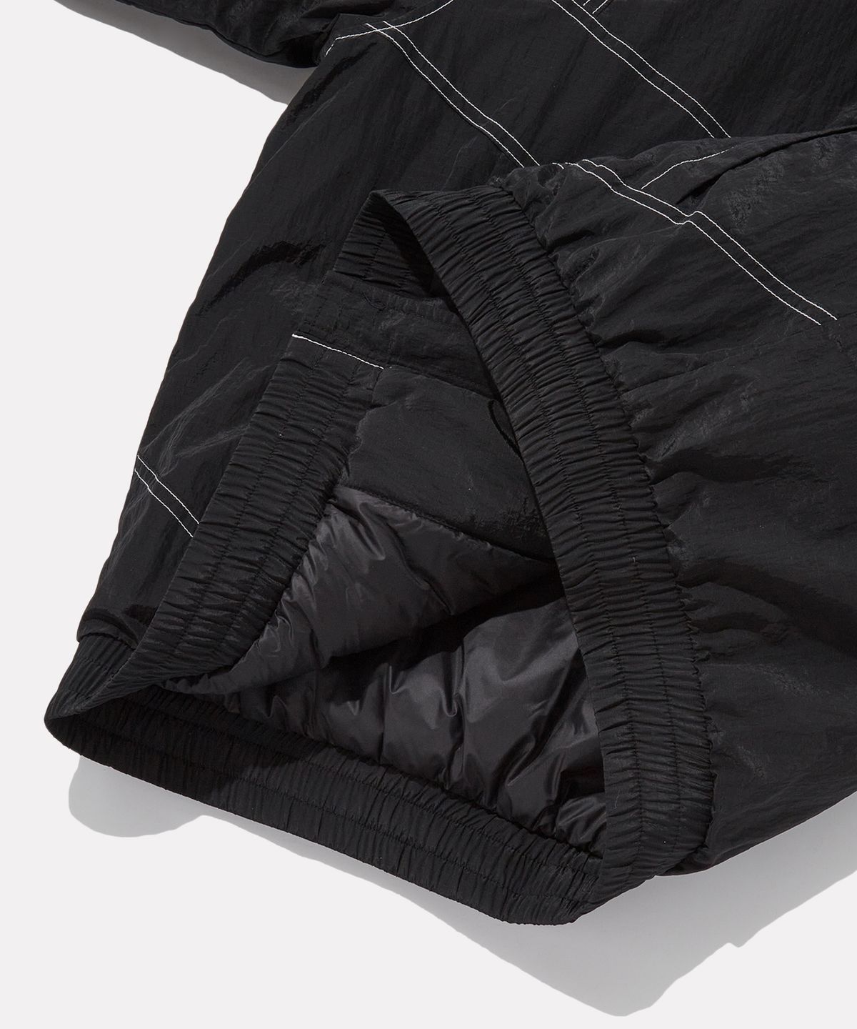 리복(REEBOK) 그리드 스티치 패딩 자켓 - 블랙