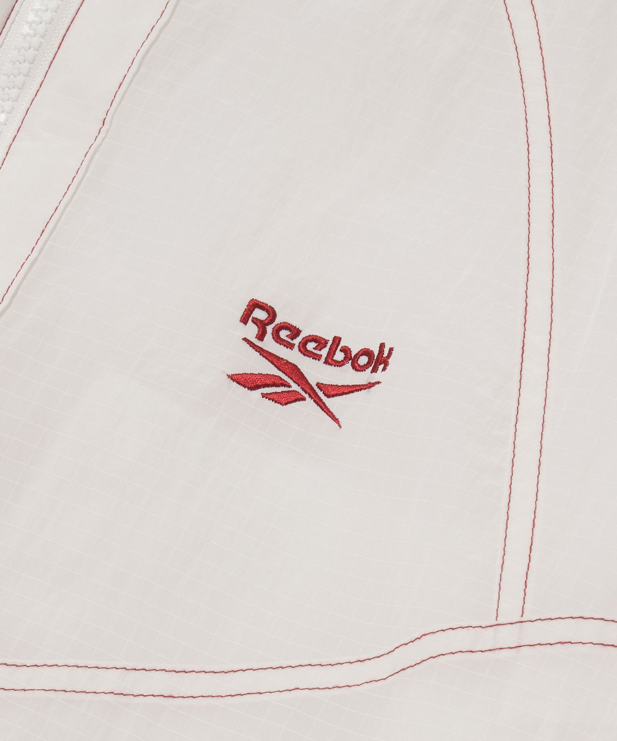 리복(REEBOK) 그리드 스티치 패딩 자켓 - 오프 화이트