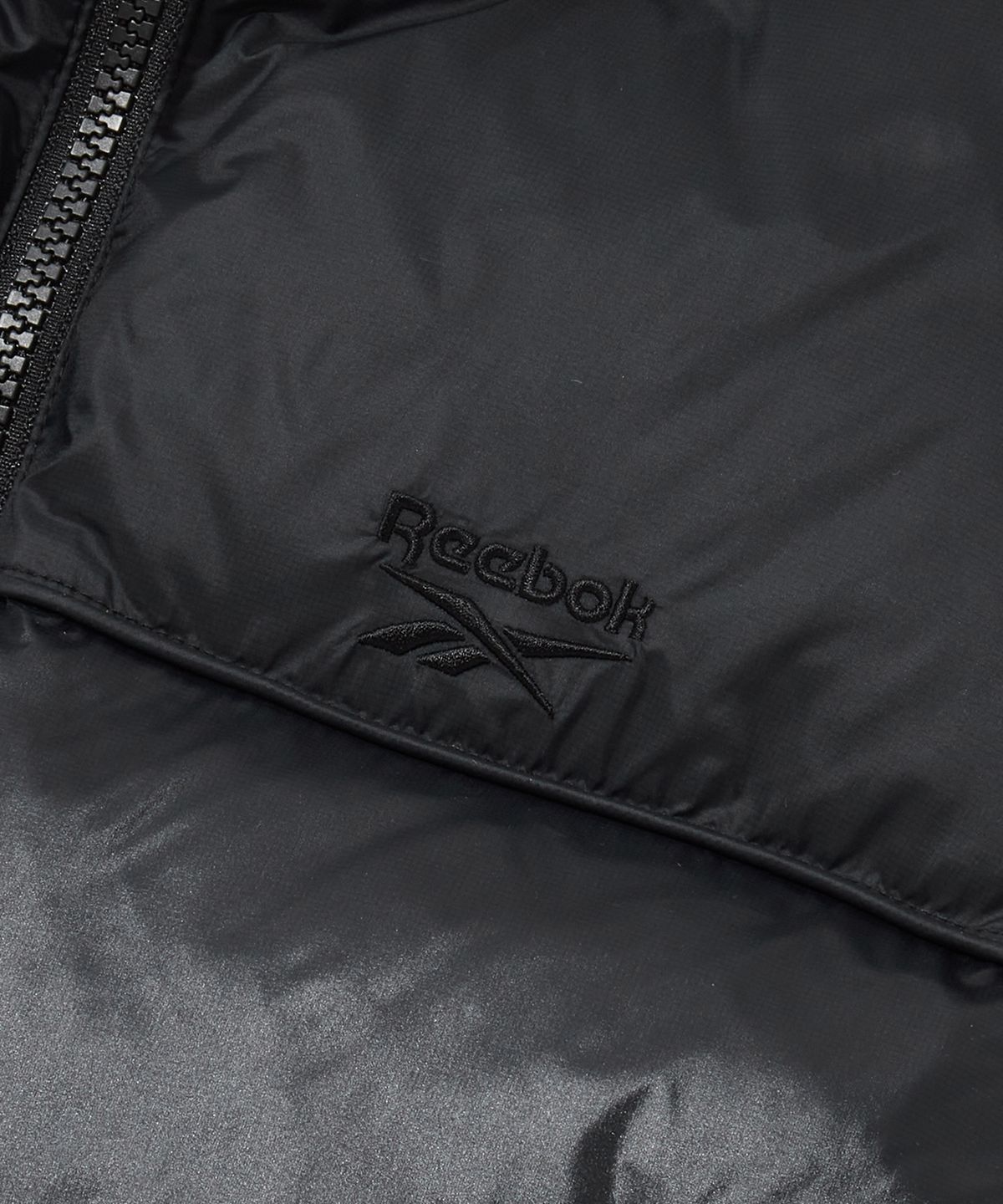 리복(REEBOK) 리버시블 패딩 베스트 (W) - 블랙