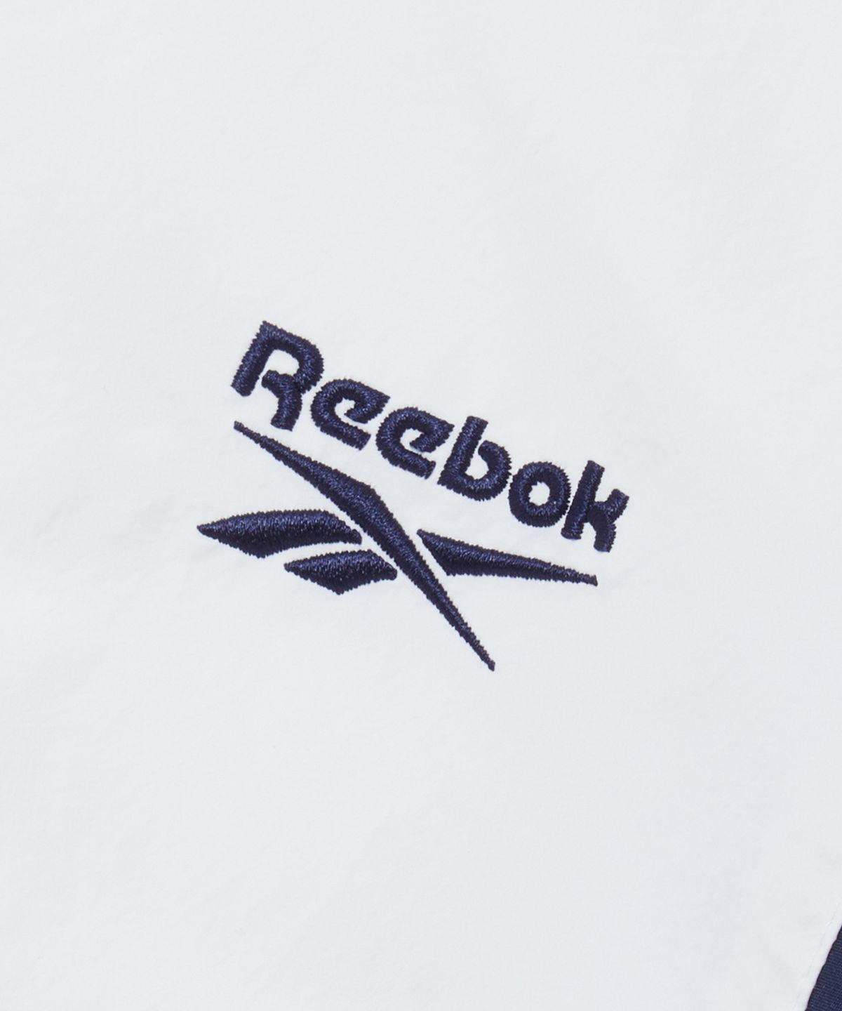 리복(REEBOK) DNA 트랙 패딩 자켓 - 페일 베이지