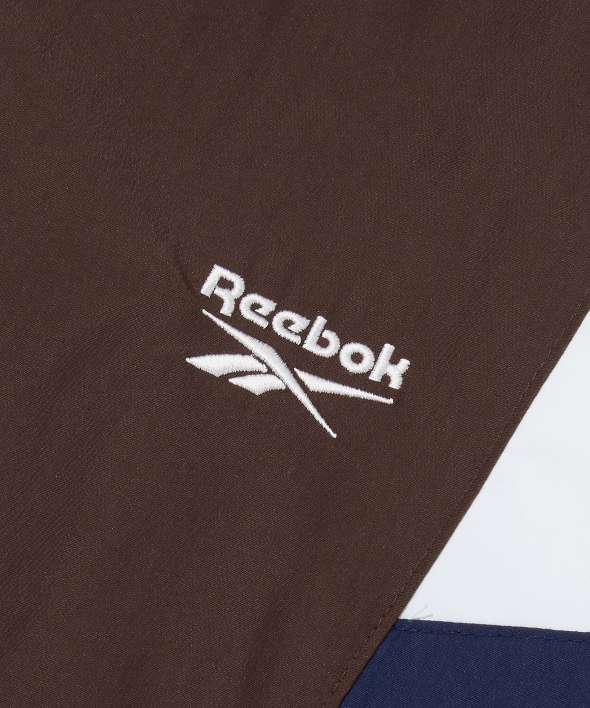 리복(REEBOK) DNA 트랙 패딩 자켓 (W) - 다크 브라운