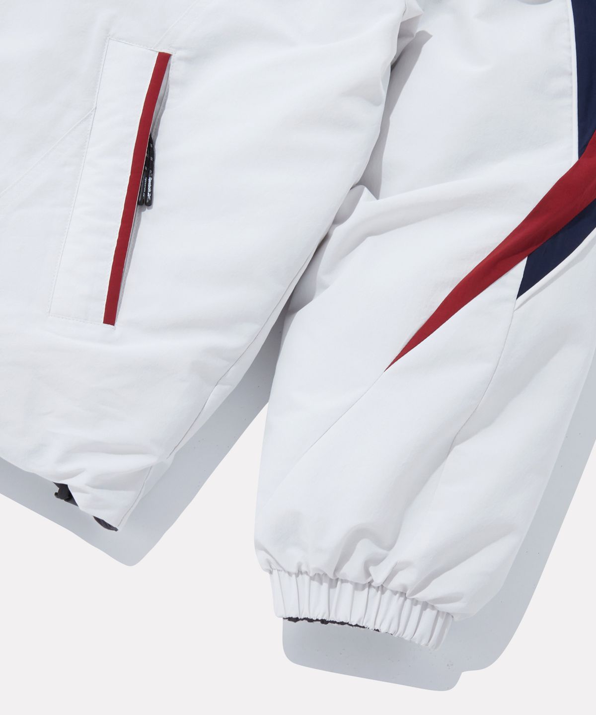 리복(REEBOK) 벡터 리버시블 패딩 - 페일 베이지:그레이