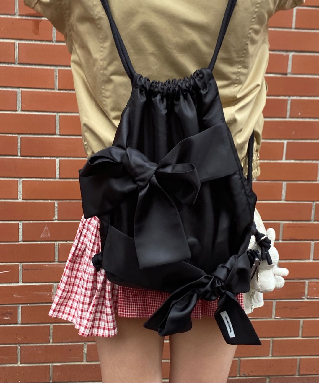 MUSINSA公式 | CRANK ダブルリボンタイドストリングバッグ_ブラック